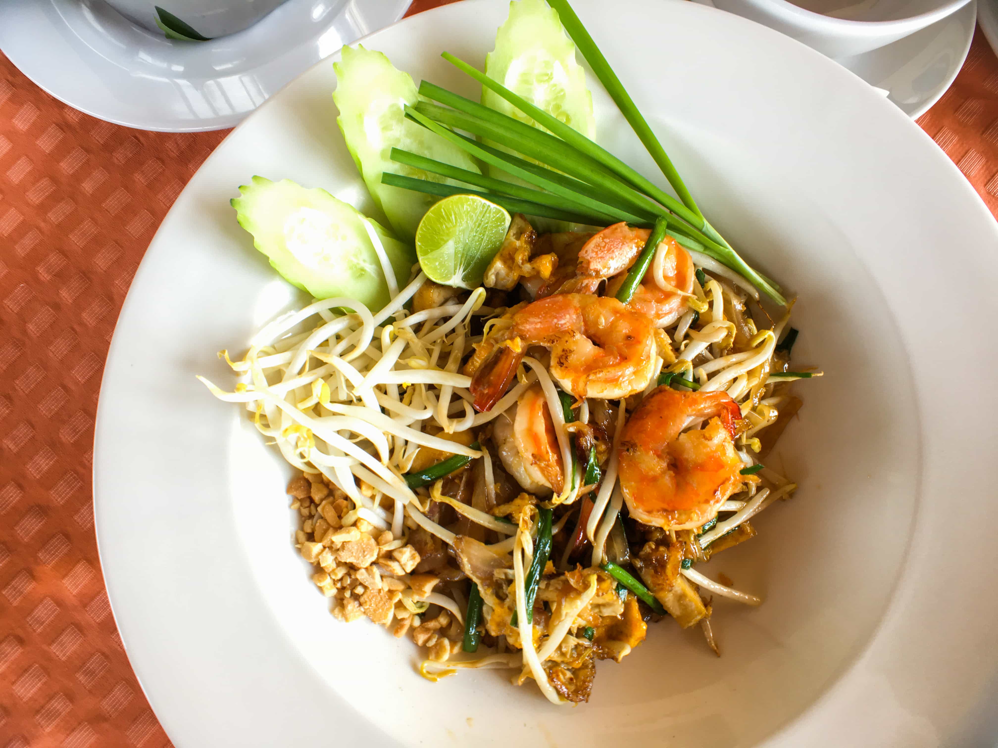 What No One Tells You Before Your First Trip to Thailand: 60 Thailand Travel Tips Every First-Timer Wishes They Knew Before Landing 21 Thai Food And Thai Dishes, Our favorite Thai food in Thailand, noodles with seafood or pork and vegetables and we enjoyed it in Riva Arun Bangkok.