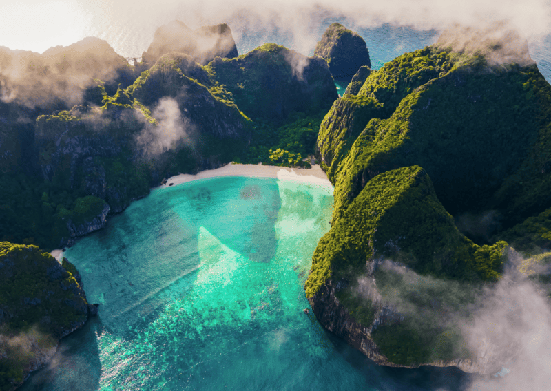 Thailand vs Philippines: Which Paradise Wins in 2026? 2 Thailand vs Philippines - A shot of Maya Bay from the top. Limestones are found in Thailand and Philippines in Palawan