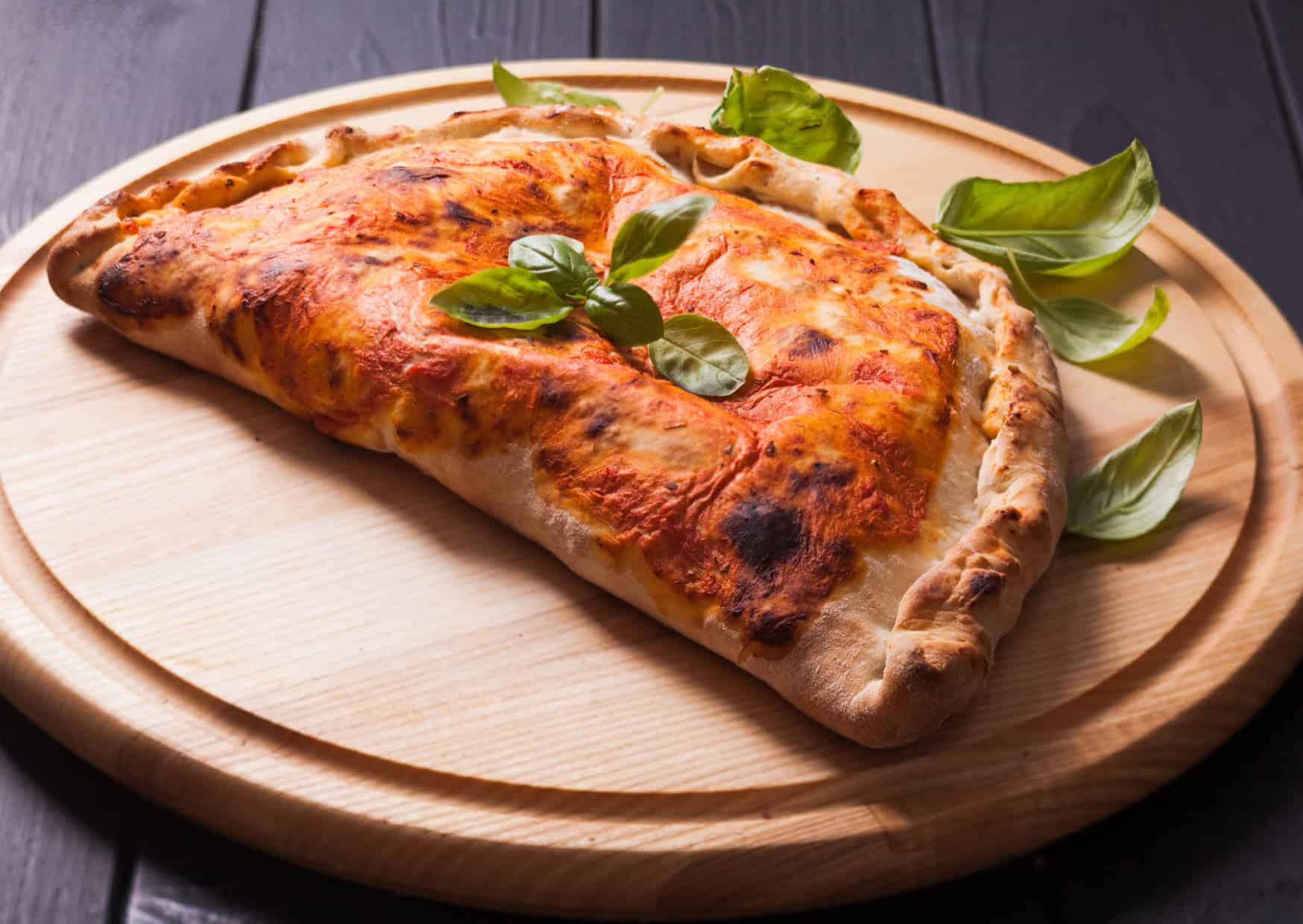The Italian Recipes America Changed So Much They Became New Dishes 5 Calzone with ham 10 Italian Recipes That Americans Changed Are They Better