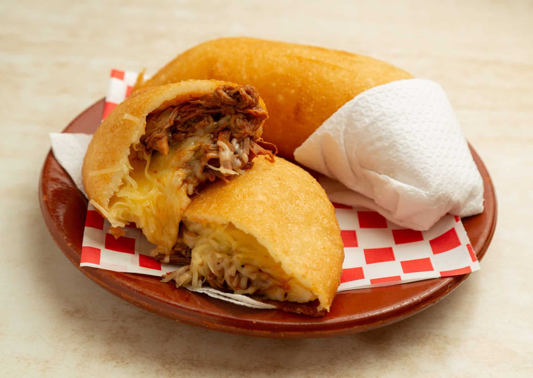 7 Most Popular Empanadas Around the World And How to Make Them 6 Venezuelan Empanada Peluda shredded meat with yellow cheese