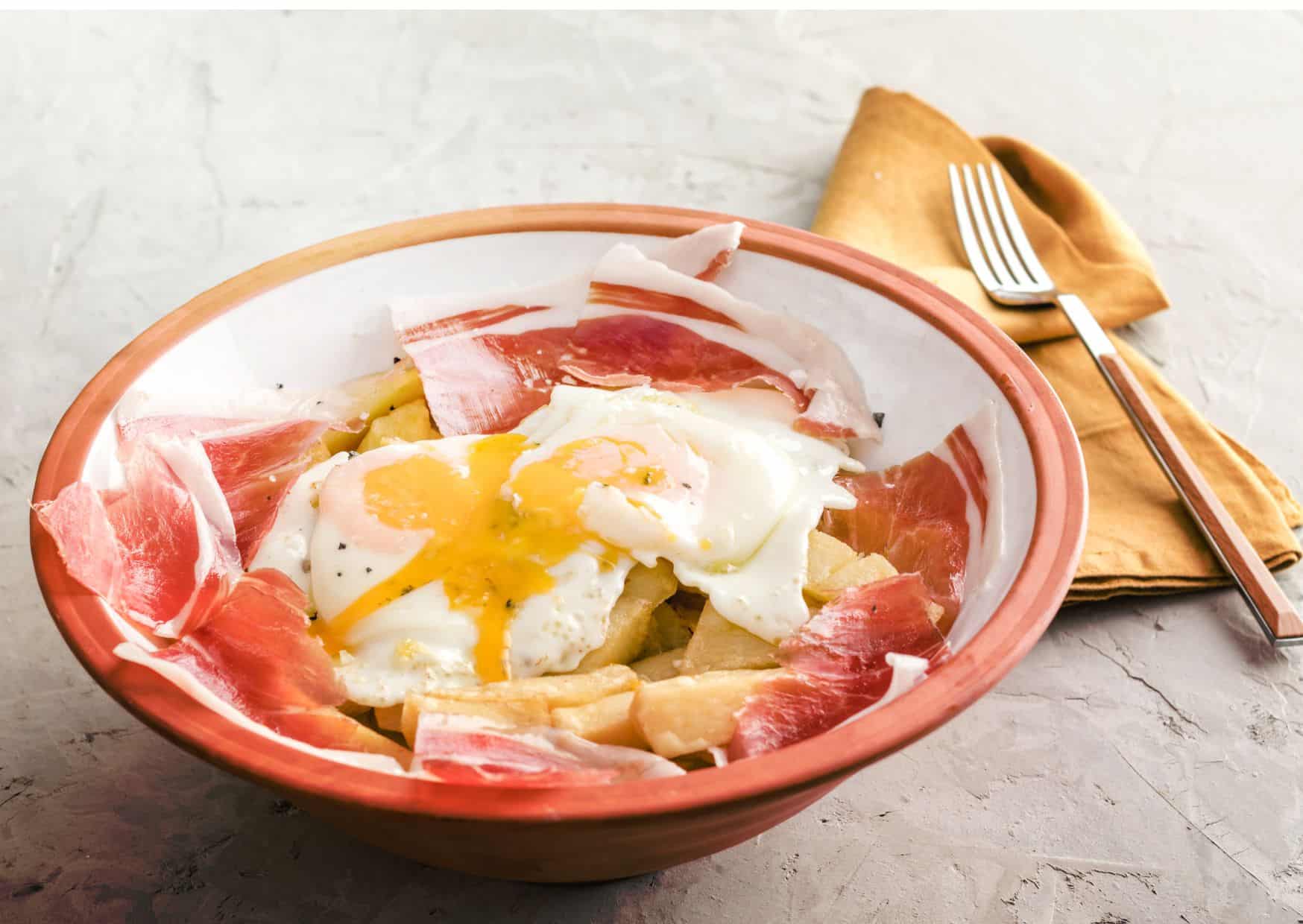 Americans Eat Bacon and Eggs And Spain Has Huevos Rotos: How to Make Spanish Broken Eggs With Ham Like a Madrid Tapas Bar 5 How To Make Spanish Broken Eggs With Ham (Recipe Guide)