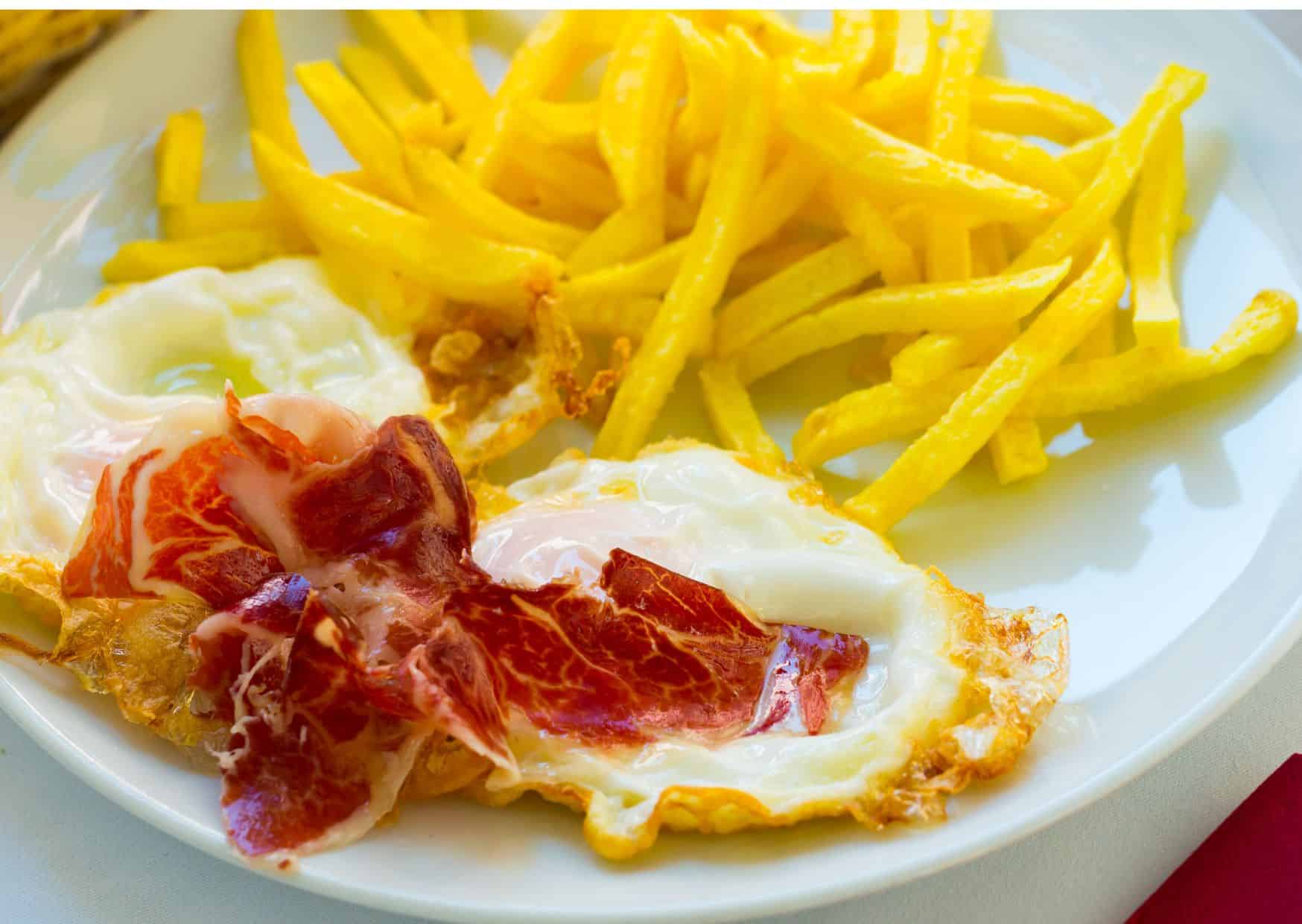 Americans Eat Bacon and Eggs And Spain Has Huevos Rotos: How to Make Spanish Broken Eggs With Ham Like a Madrid Tapas Bar 3 How To Make Spanish Broken Eggs With Ham (Recipe Guide)