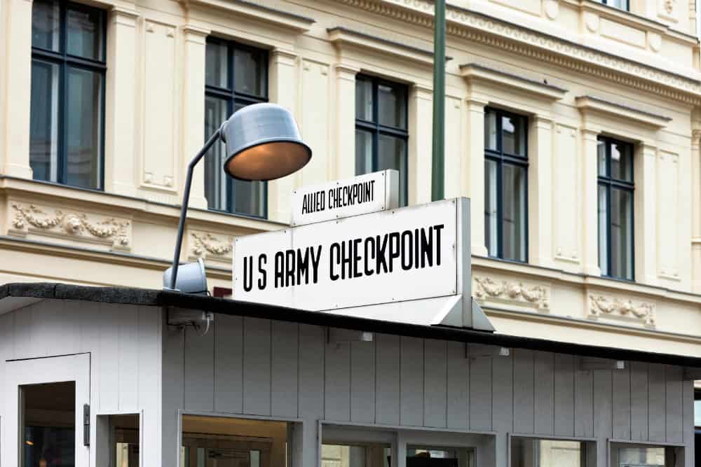 13 Tourist Traps Europeans Avoid—And the Secret Spots They Visit Instead 9 13 Tourist Traps Europeans Never Visit Checkpoint Charlie Berlin