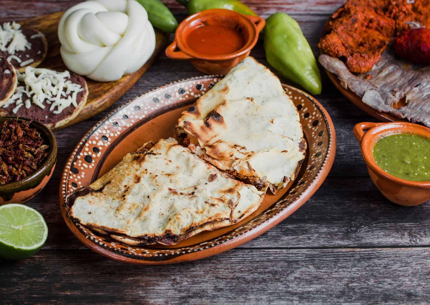 Why Tlayudas Are Called Mexican Pizza But Taste Nothing Like It: How To Make Authentic Oaxacan Tlayudas At Home 2 Most Popular Foods In Mexico: How To Make Tlayudas (Recipe Guide)